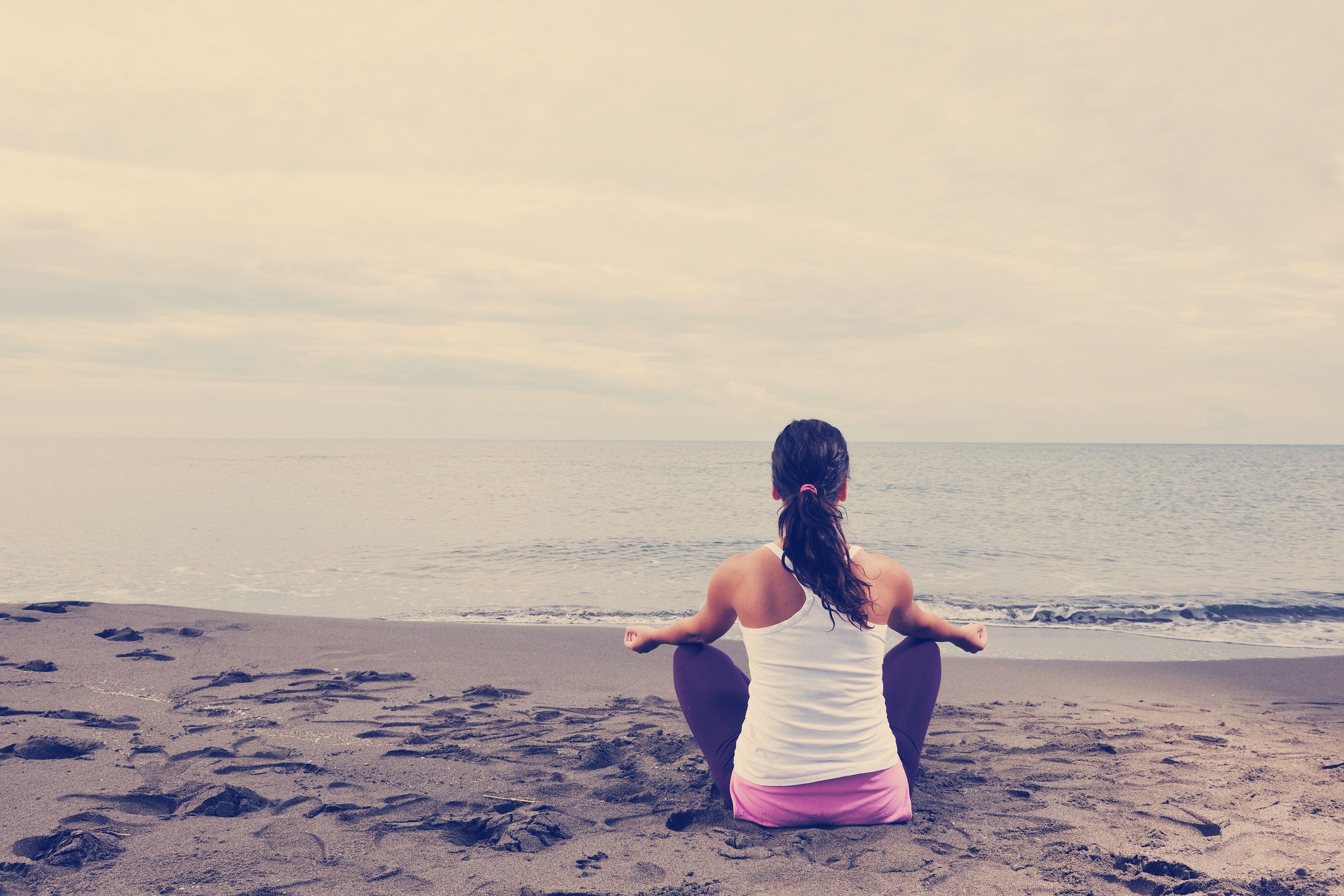 woman yoga beach